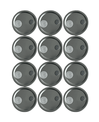 12 modified mason jar lids fitted with injection ports and .22 micron gas exchange filters for mushroom spawn jars